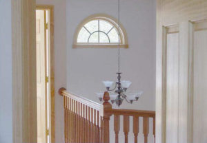 Upstairs Railing with a view of the chandelier